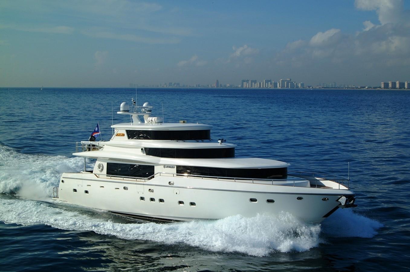 a white boat on the water aboard JOHNSON 93 SKYLOUNGE Yacht for Sale