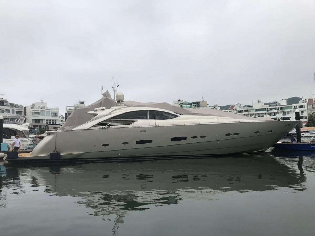 a white yacht in a harbor aboard PERSHING 90/12 Yacht for Sale