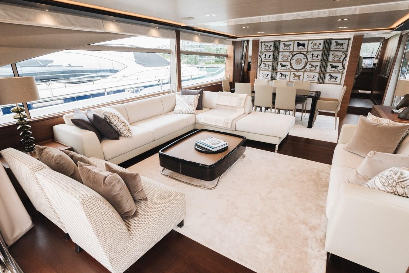 a living room with a large window aboard ISLAND PRINCESS Yacht for Sale
