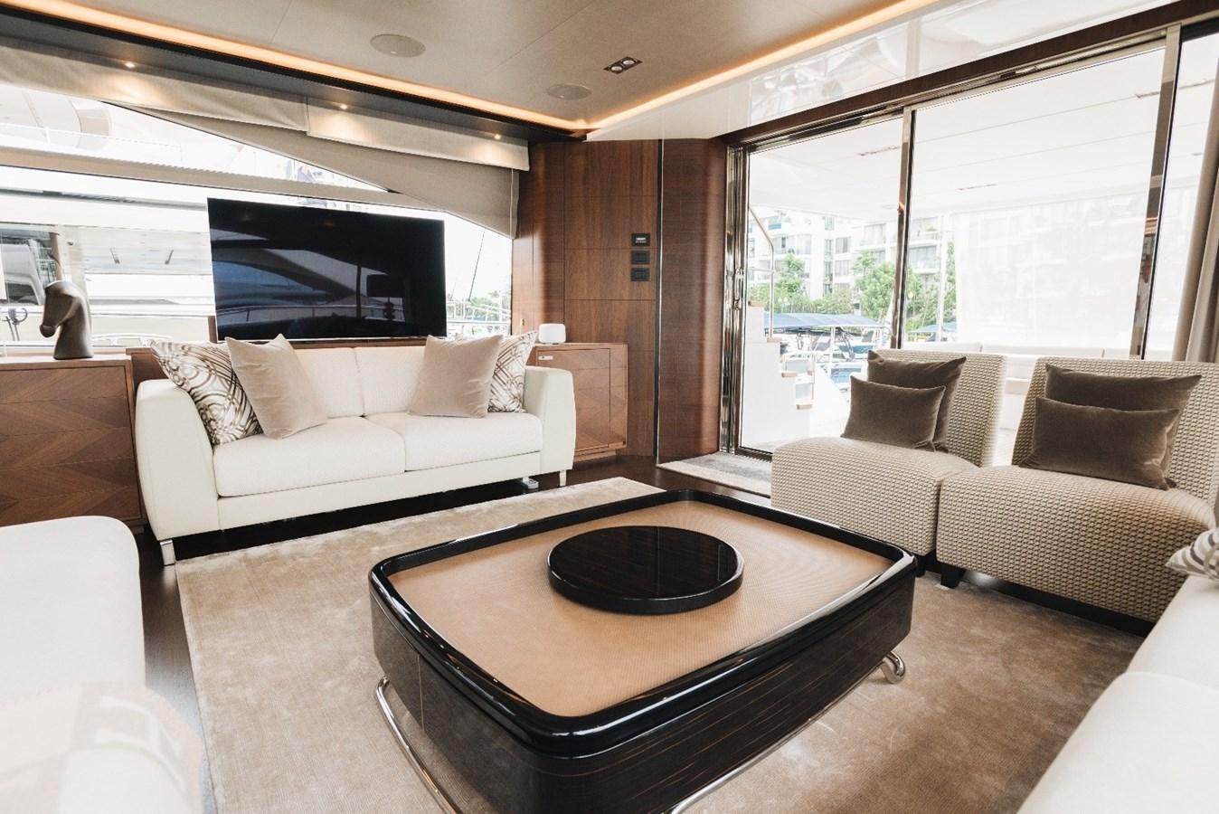 a living room with a large window aboard ISLAND PRINCESS Yacht for Sale