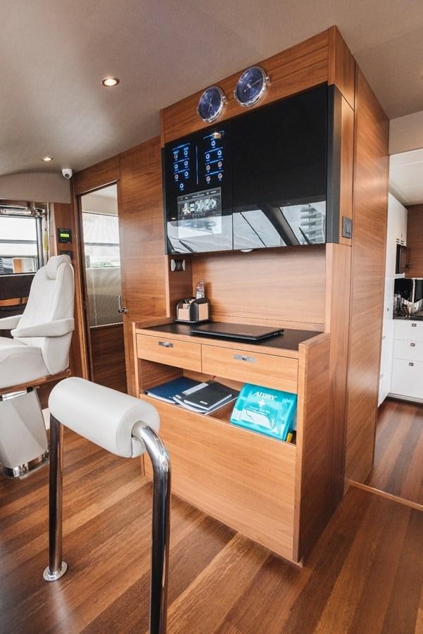 a wood cabinet with a television on it aboard ISLAND PRINCESS Yacht for Sale
