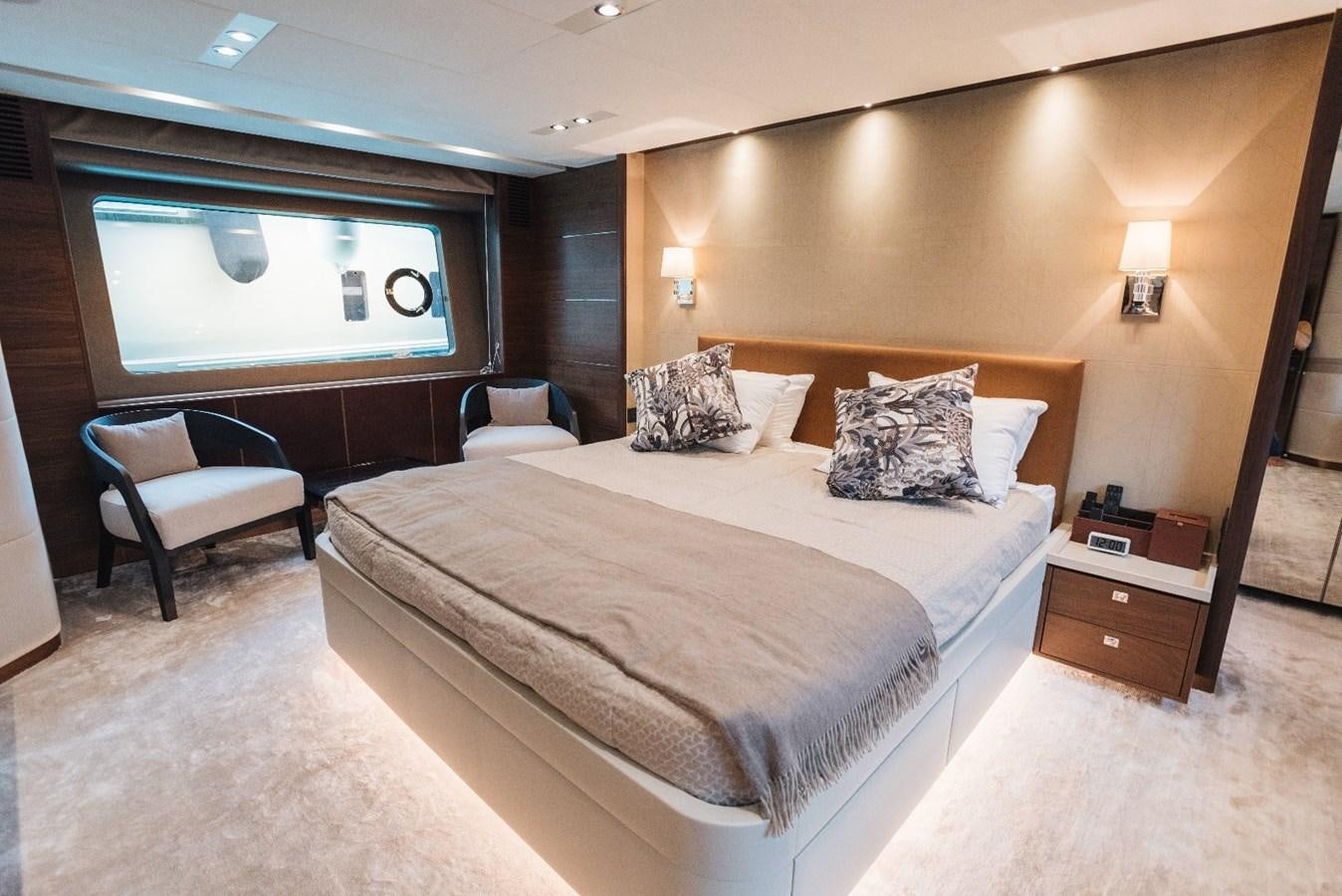 a hotel room with a bed and a tv aboard ISLAND PRINCESS Yacht for Sale