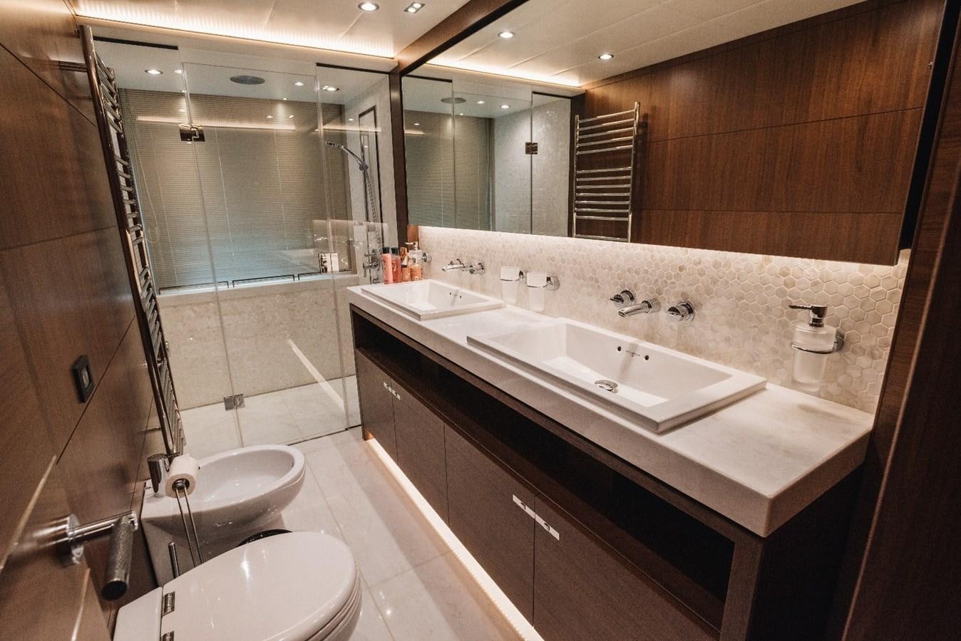 a bathroom with a large mirror aboard ISLAND PRINCESS Yacht for Sale