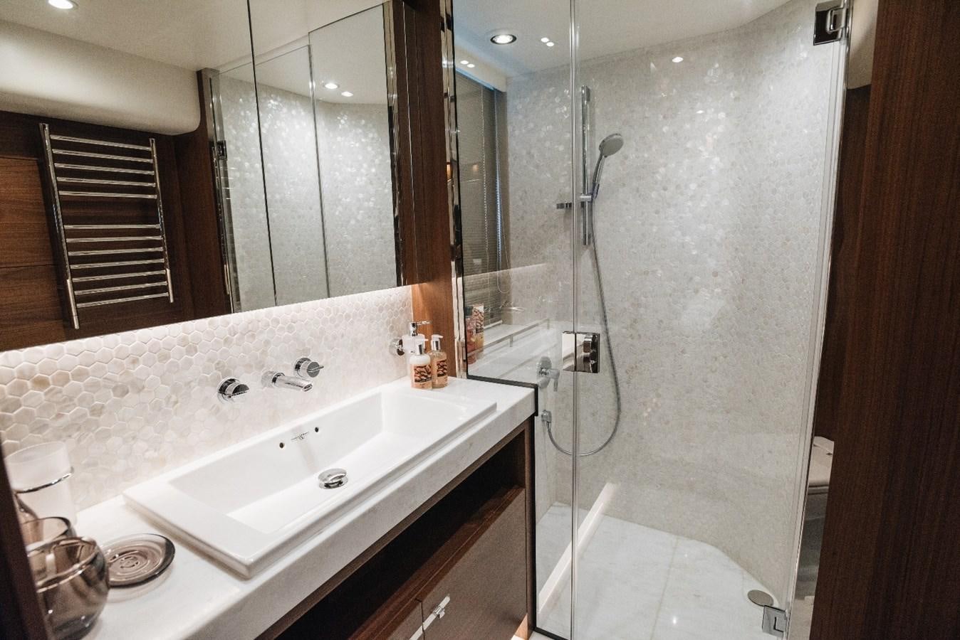 a bathroom with a shower and sink aboard ISLAND PRINCESS Yacht for Sale