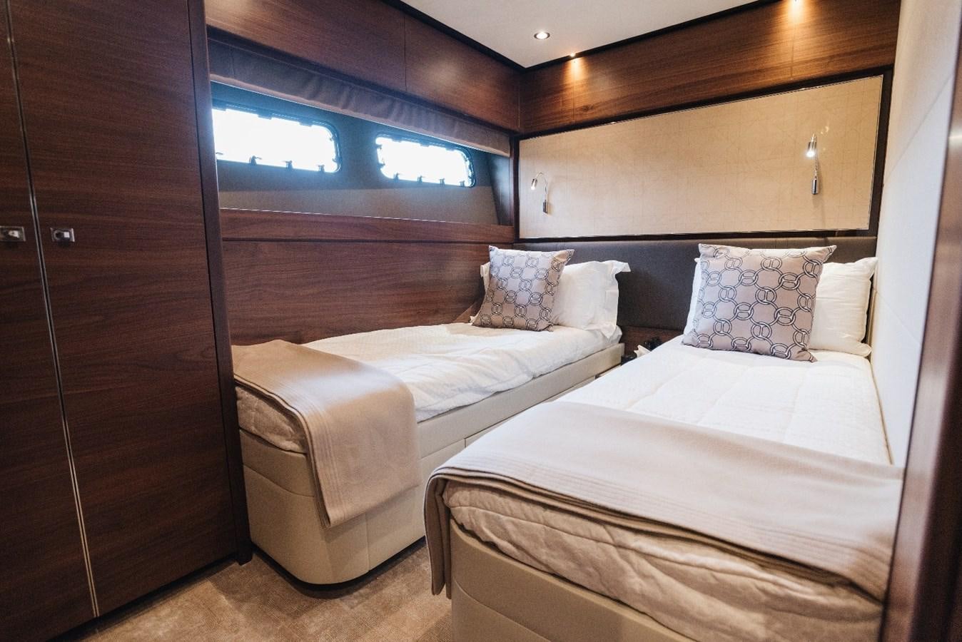 a couple of beds in a room aboard ISLAND PRINCESS Yacht for Sale