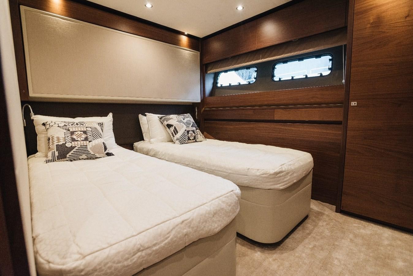a room with two beds aboard ISLAND PRINCESS Yacht for Sale
