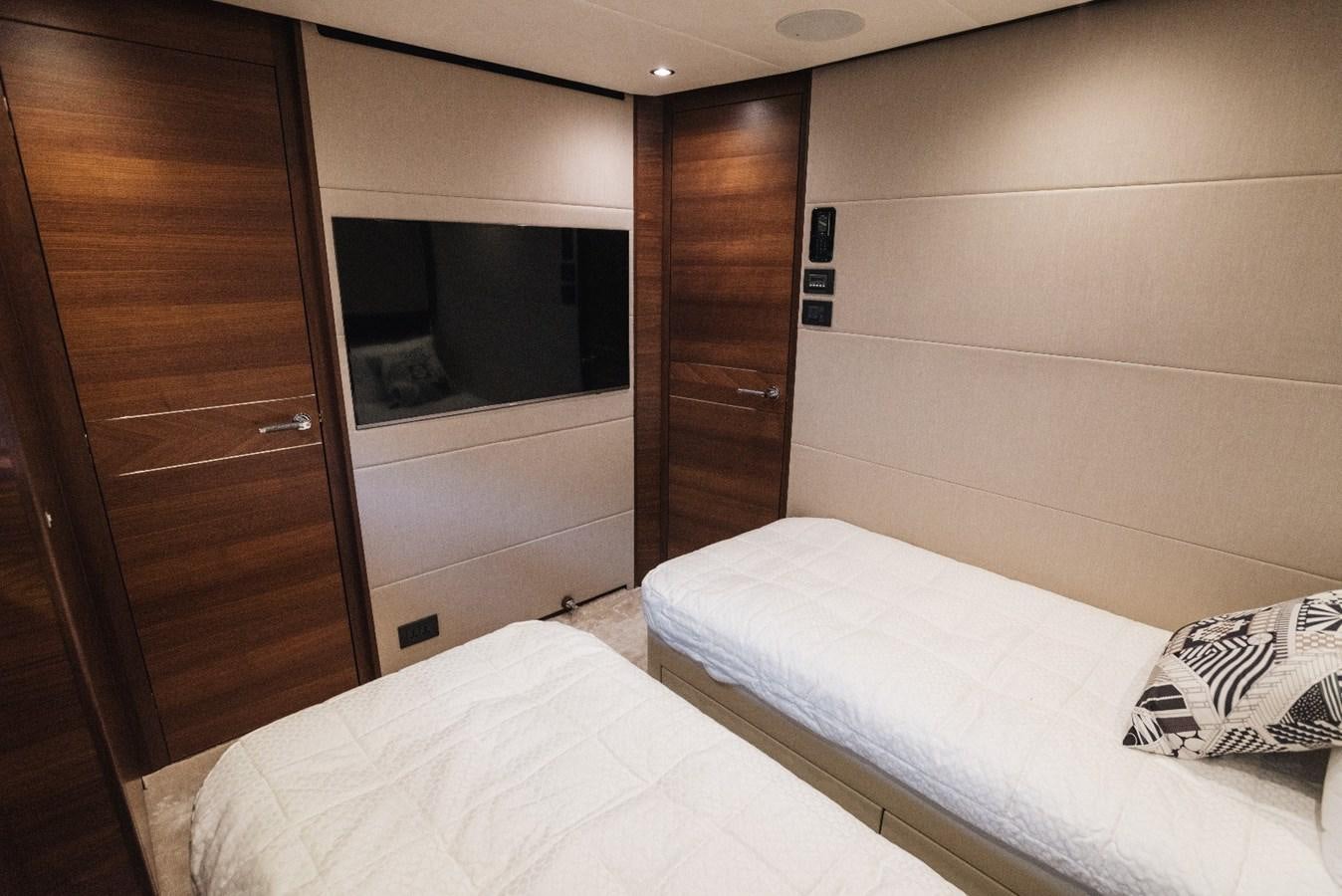 a room with a bed and a closet aboard ISLAND PRINCESS Yacht for Sale