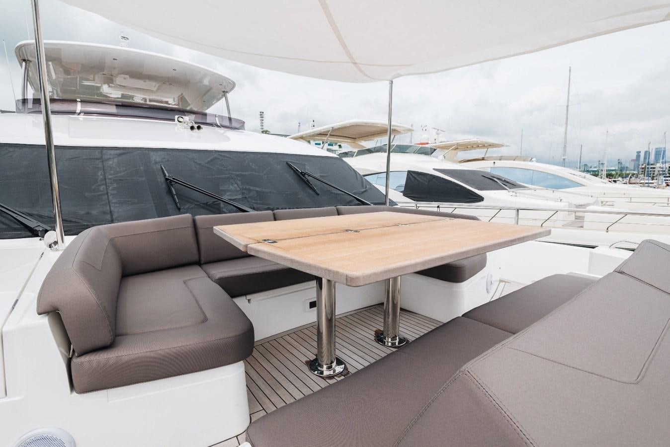 a table and chairs on a boat aboard ISLAND PRINCESS Yacht for Sale