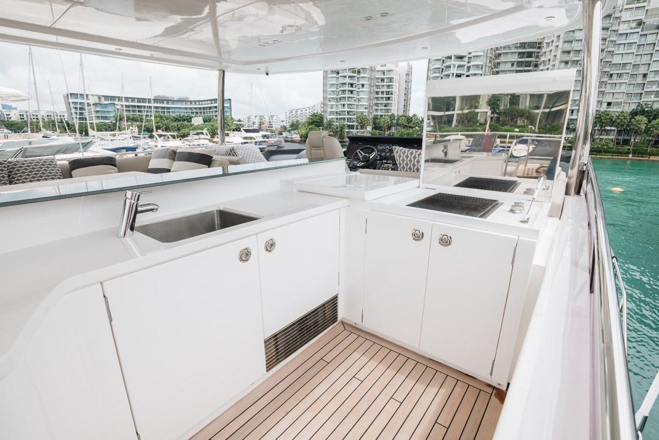 a kitchen with a large window aboard ISLAND PRINCESS Yacht for Sale
