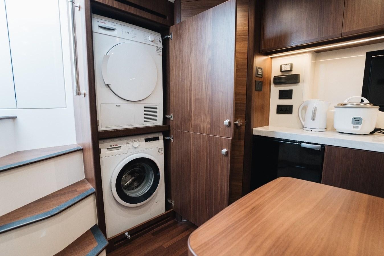 a small kitchen with a washing machine aboard ISLAND PRINCESS Yacht for Sale