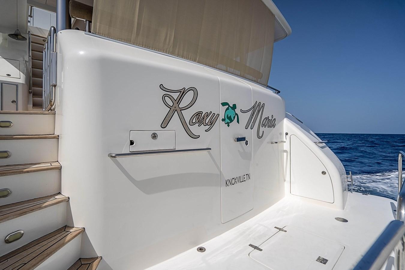 a white boat with a sign on the front aboard ROXY MARIA Yacht for Sale