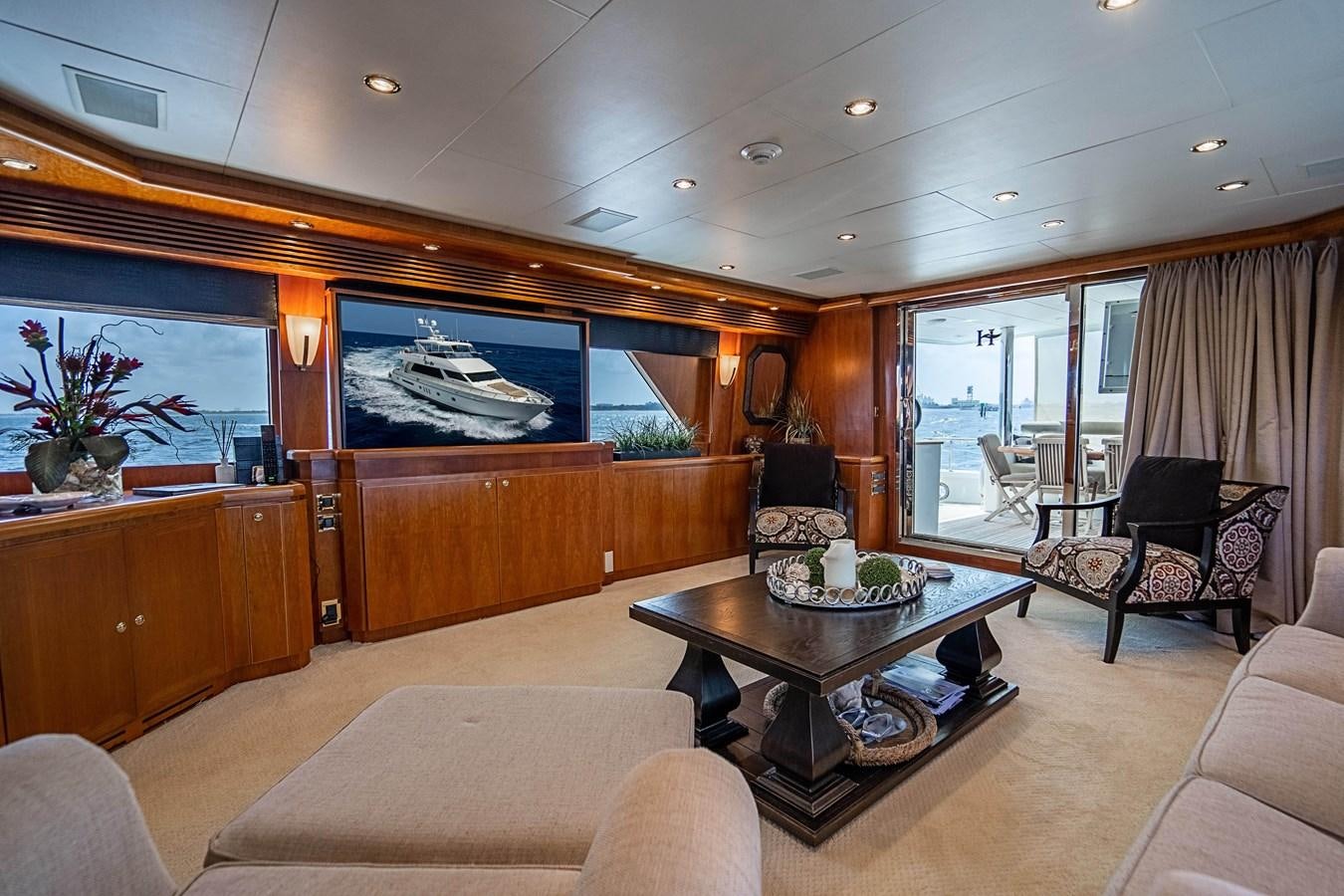 a living room with a table and chairs aboard ROXY MARIA Yacht for Sale