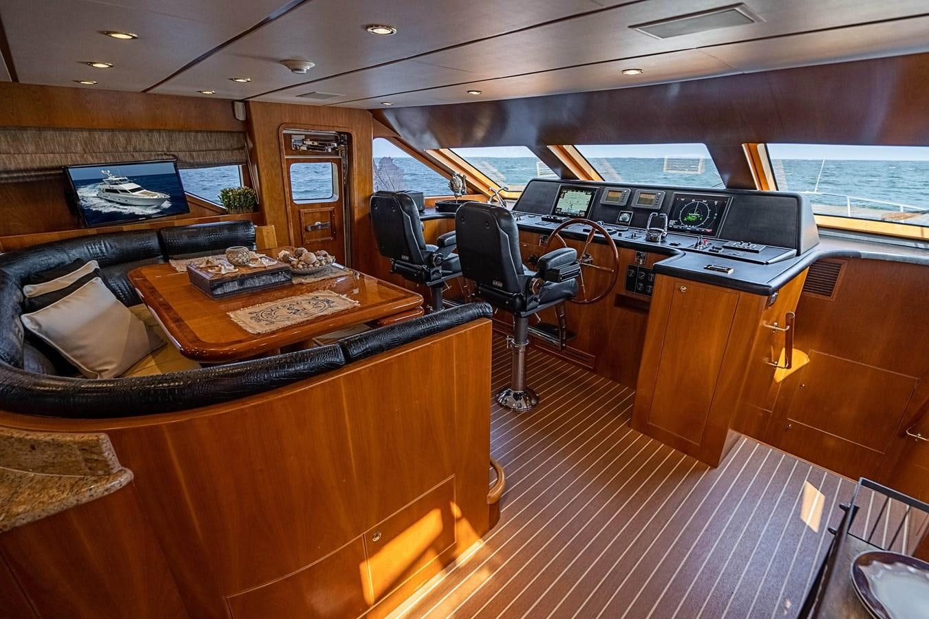 a room with a table and chairs aboard ROXY MARIA Yacht for Sale
