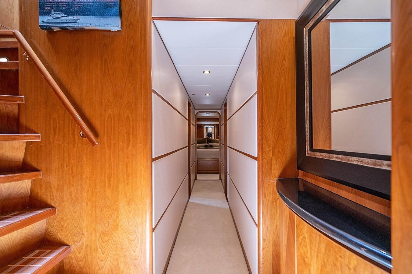 a hallway with wooden stairs aboard ROXY MARIA Yacht for Sale