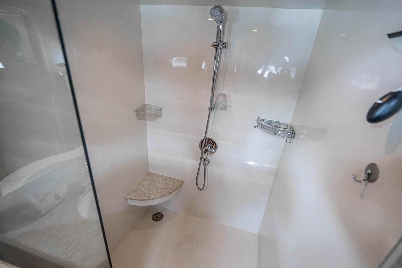 a bathroom with a shower and a sink aboard ROXY MARIA Yacht for Sale