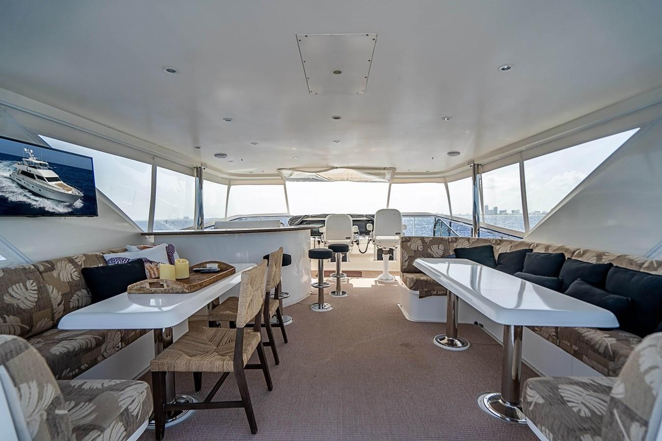 a room with a couch and a table and chairs aboard ROXY MARIA Yacht for Sale