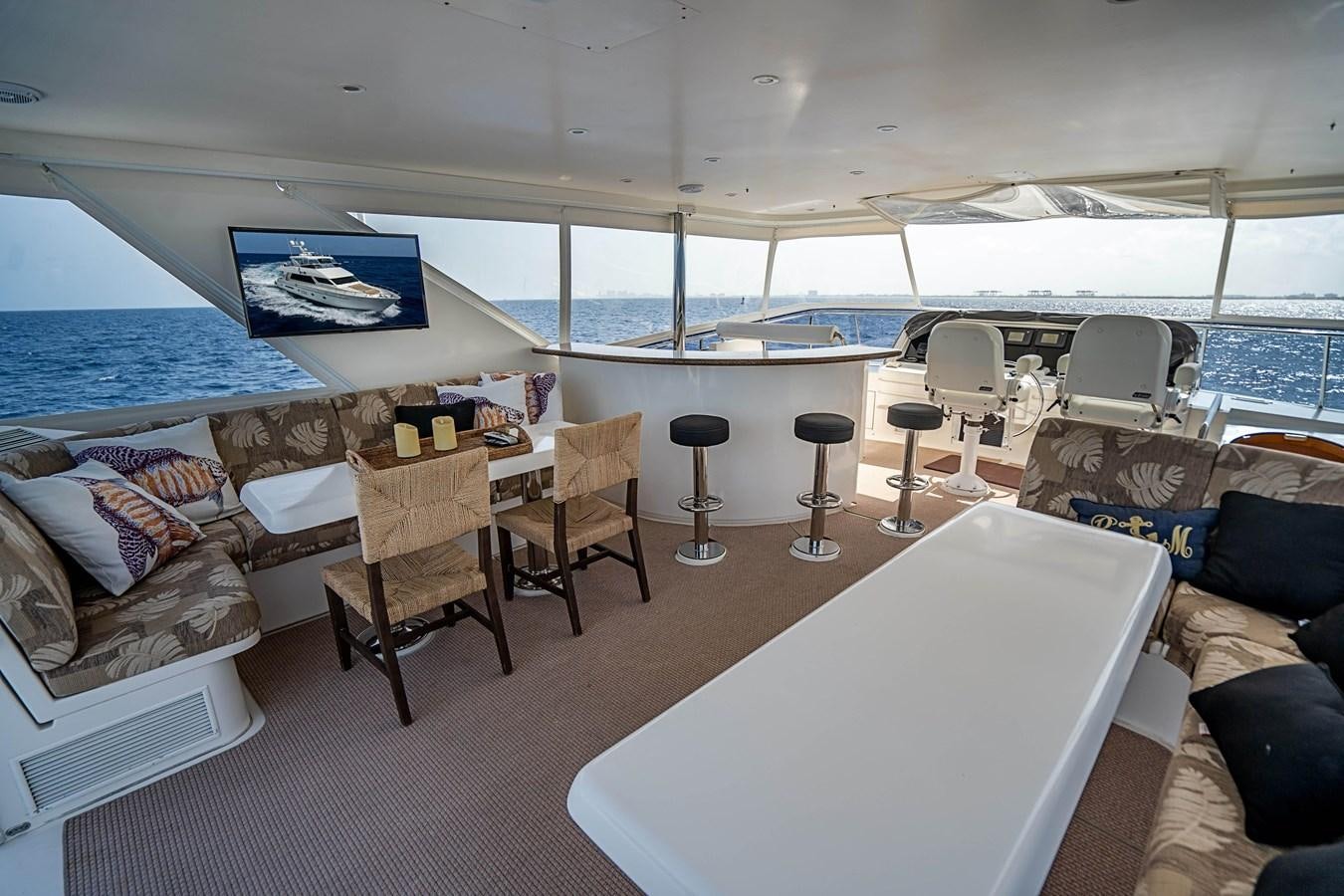 a room with a bed and chairs aboard ROXY MARIA Yacht for Sale