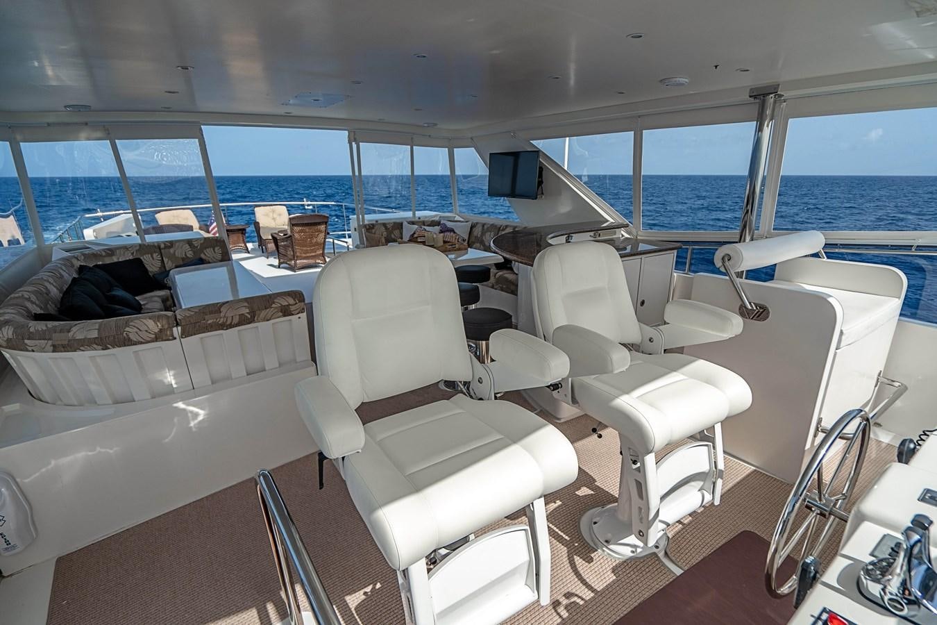 a room with a view of the ocean and the deck aboard ROXY MARIA Yacht for Sale