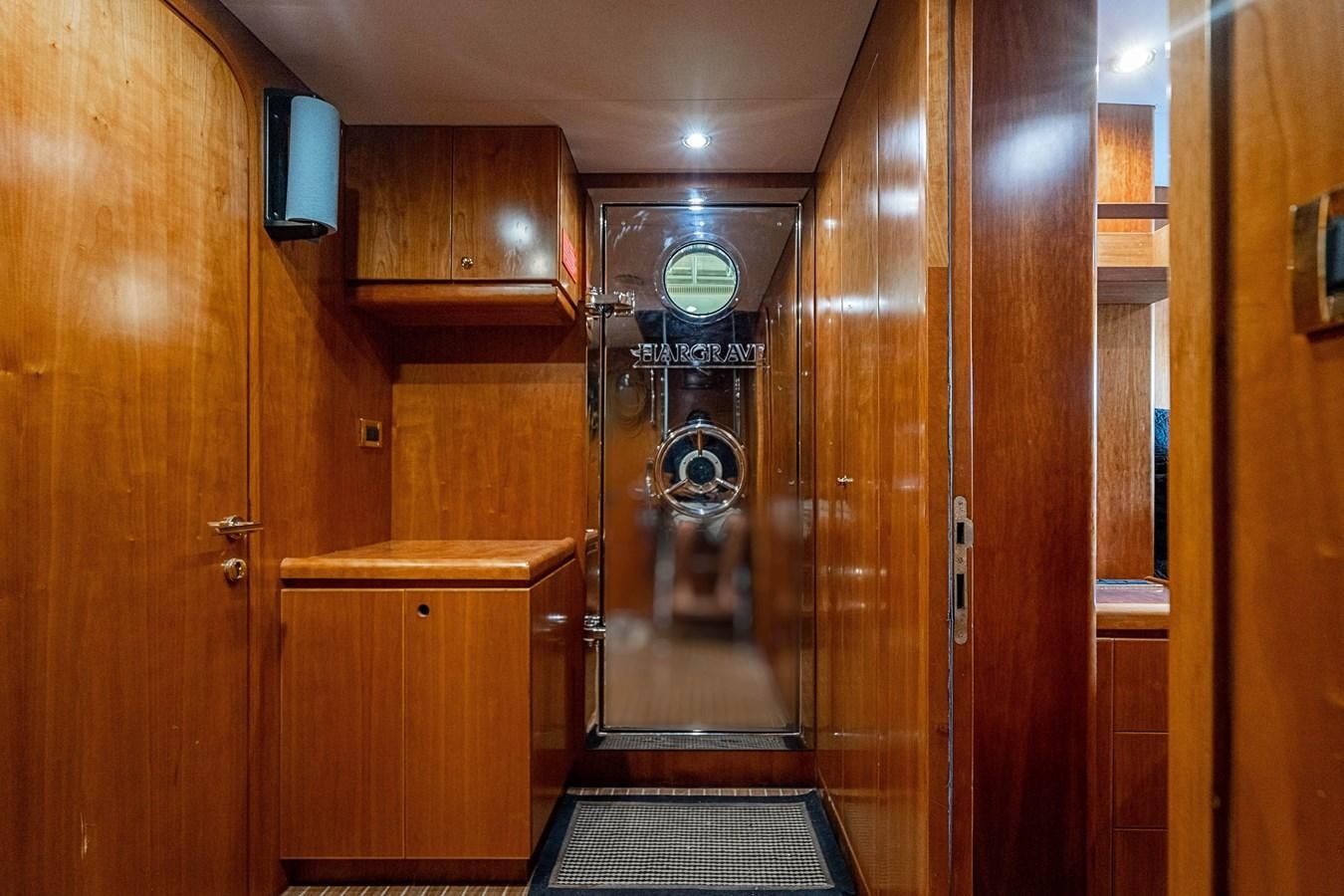 a room with wooden cabinets aboard ROXY MARIA Yacht for Sale