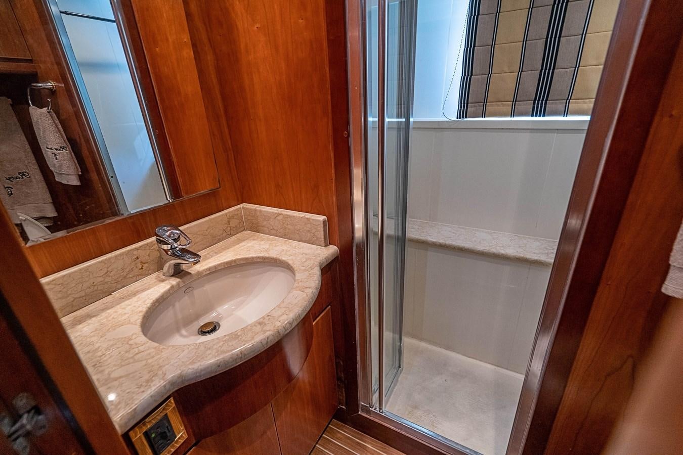 a bathroom with a sink and a shower aboard ROXY MARIA Yacht for Sale