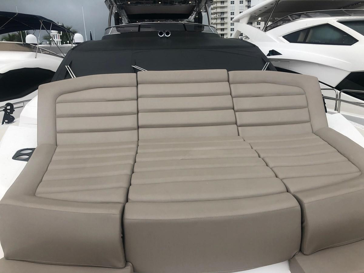 a white car with a black hood aboard AQUA VISTA Yacht for Sale