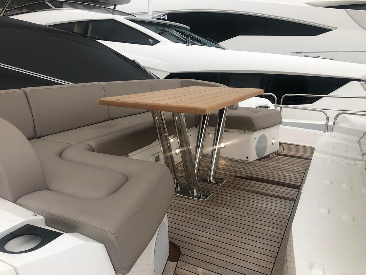 a table and chairs in a car aboard AQUA VISTA Yacht for Sale