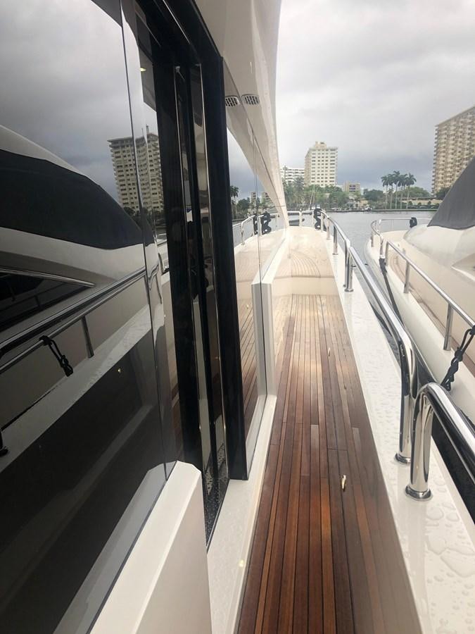a deck with a view of a city and water aboard AQUA VISTA Yacht for Sale