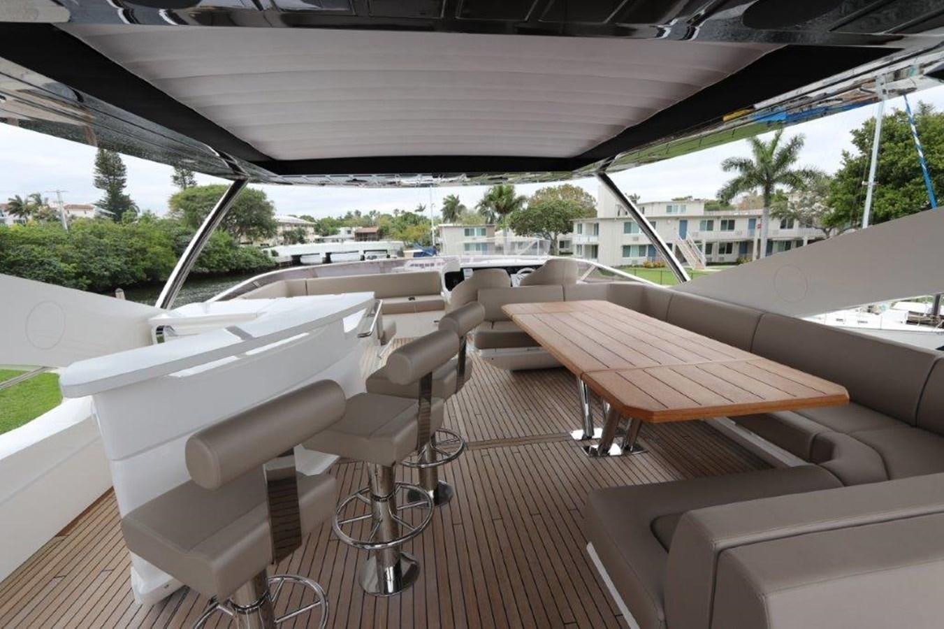 a room with a table and chairs aboard AQUA VISTA Yacht for Sale