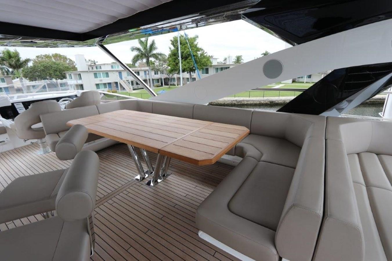a room with a table and chairs aboard AQUA VISTA Yacht for Sale