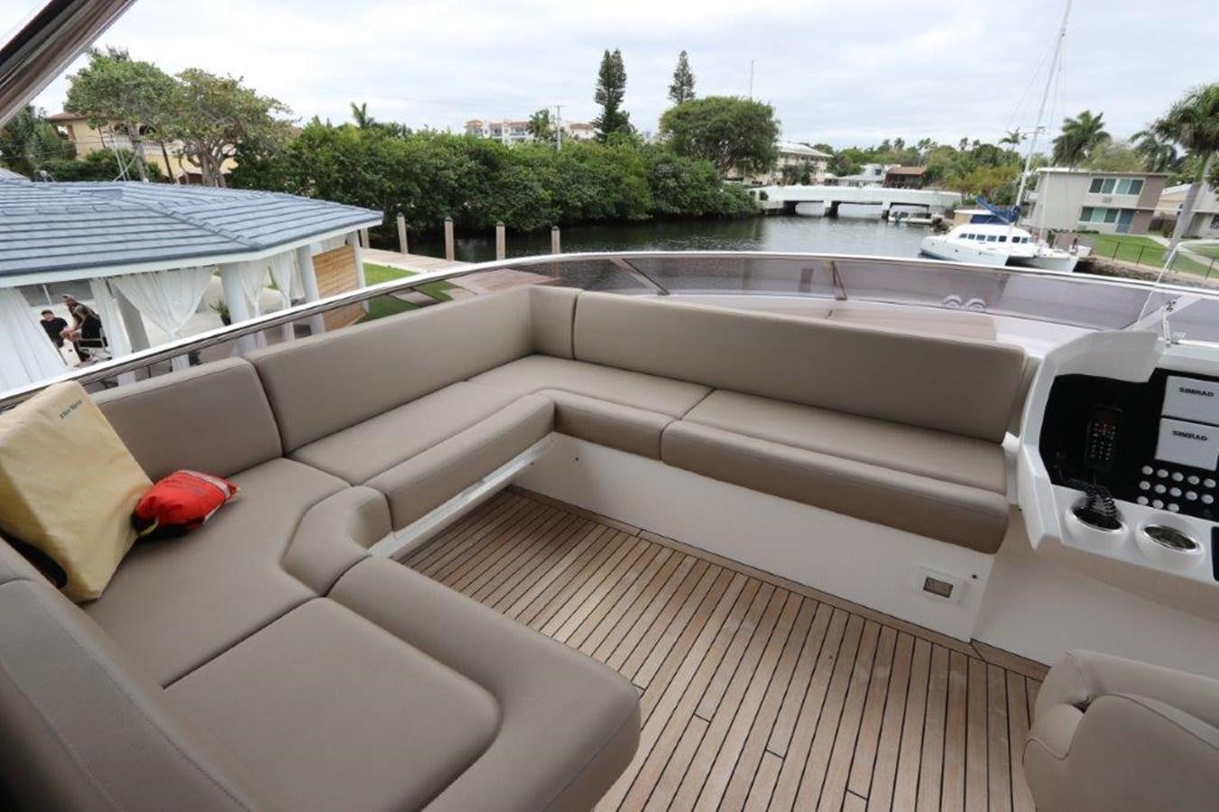 a deck with a couch and a pool aboard AQUA VISTA Yacht for Sale
