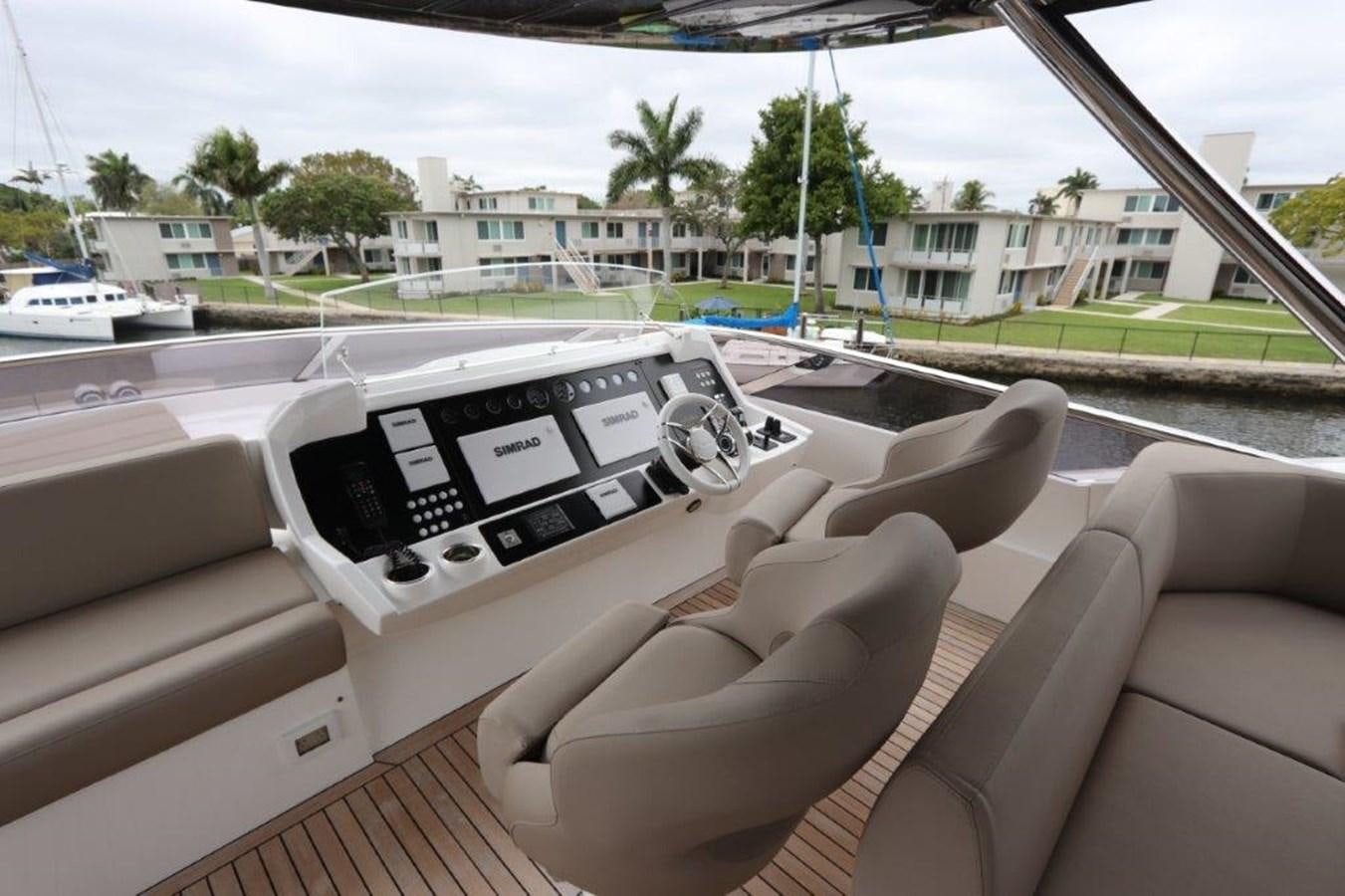 a white laptop on a chair aboard AQUA VISTA Yacht for Sale