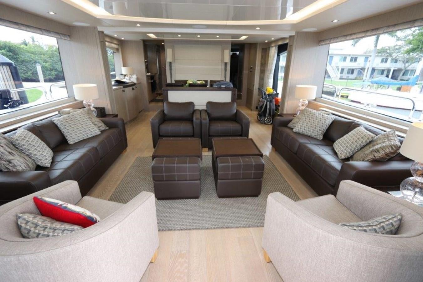 a living room with a couch and a table aboard AQUA VISTA Yacht for Sale