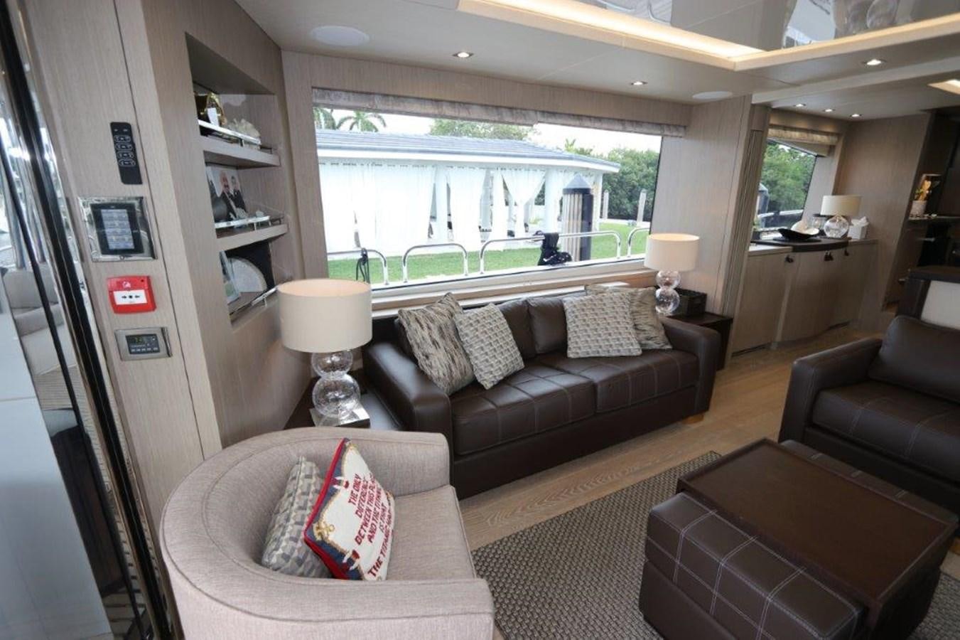a living room with a large window aboard AQUA VISTA Yacht for Sale