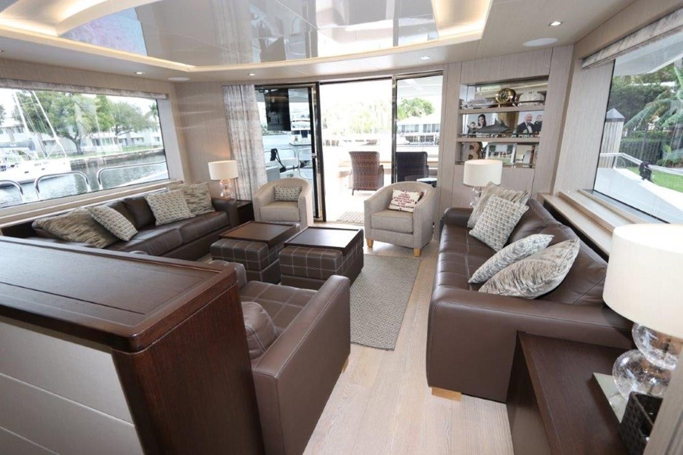 a living room with a large window aboard AQUA VISTA Yacht for Sale
