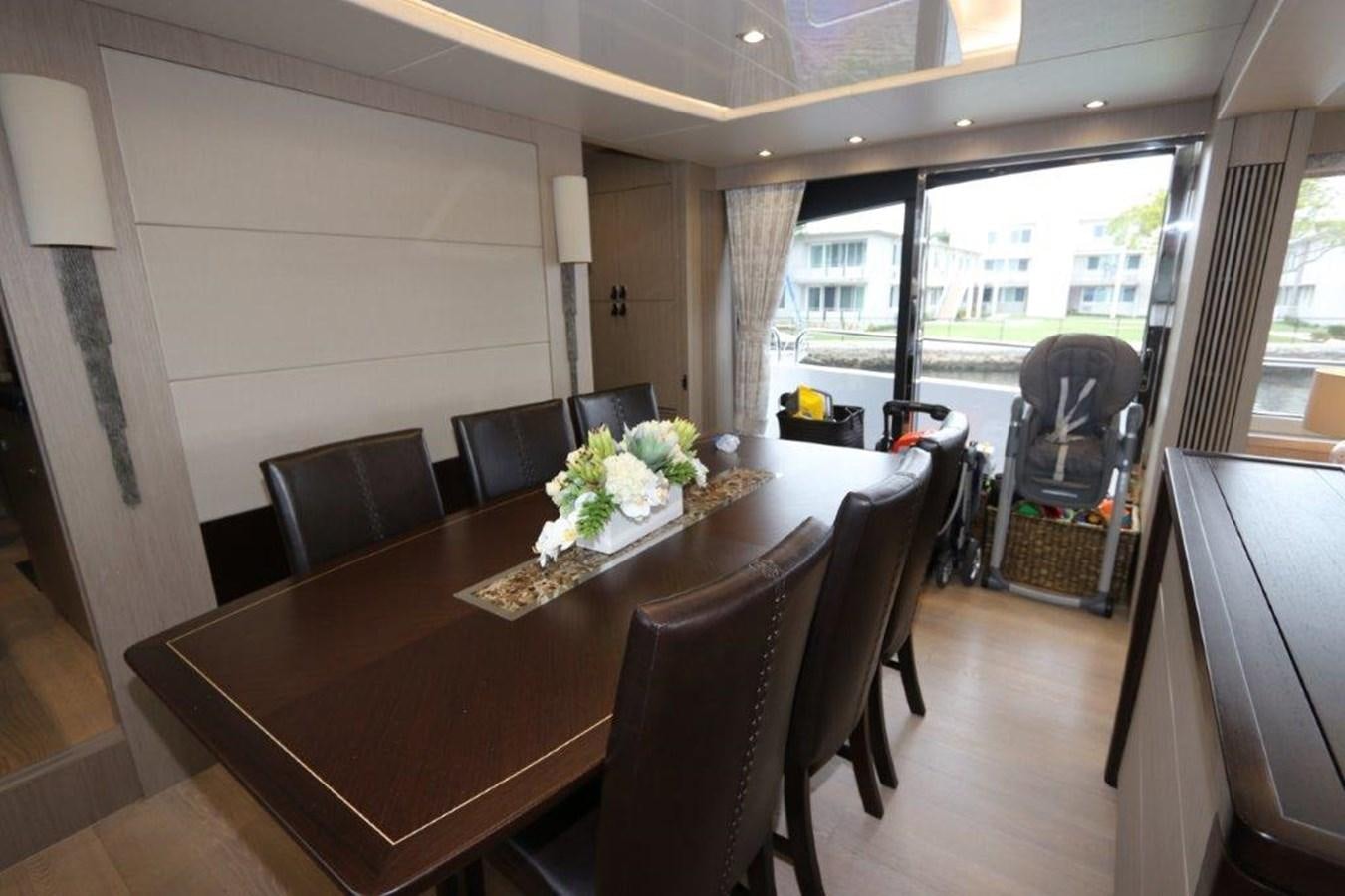 a dining table in a room aboard AQUA VISTA Yacht for Sale