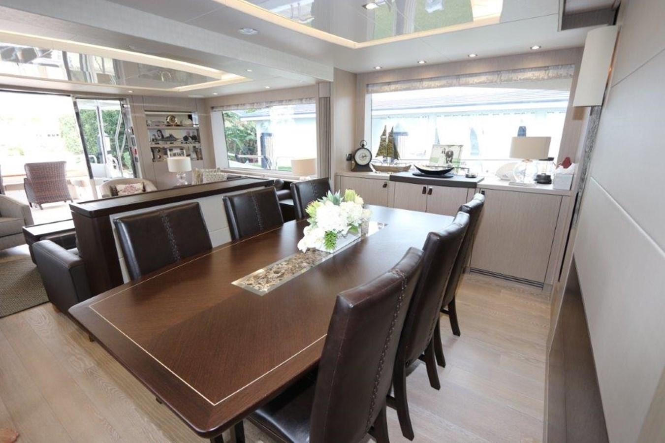 a kitchen with a dining table aboard AQUA VISTA Yacht for Sale