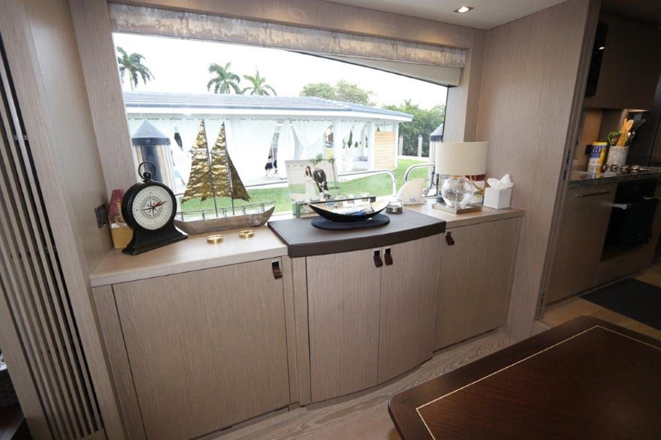 a kitchen with a large window aboard AQUA VISTA Yacht for Sale