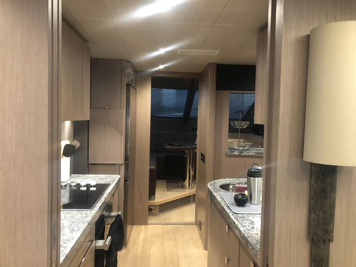 a kitchen with a large mirror aboard AQUA VISTA Yacht for Sale