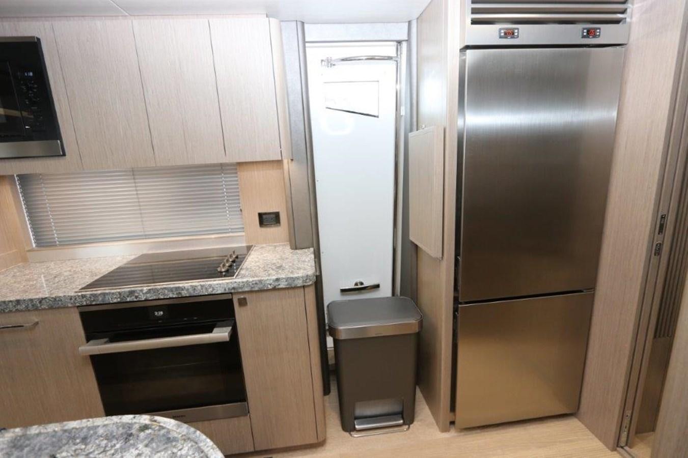 a kitchen with stainless steel appliances aboard AQUA VISTA Yacht for Sale