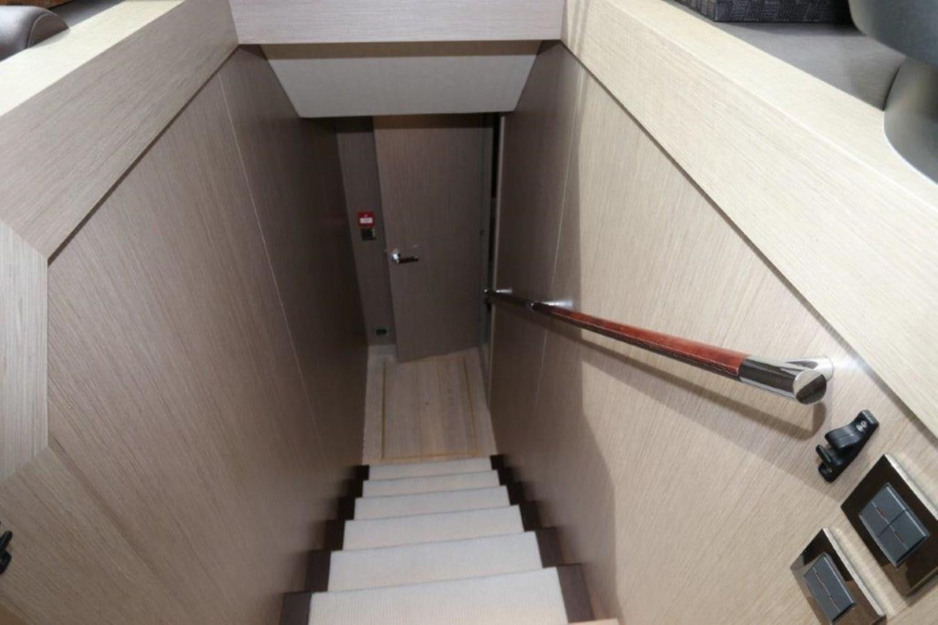 a wooden staircase in a room aboard AQUA VISTA Yacht for Sale