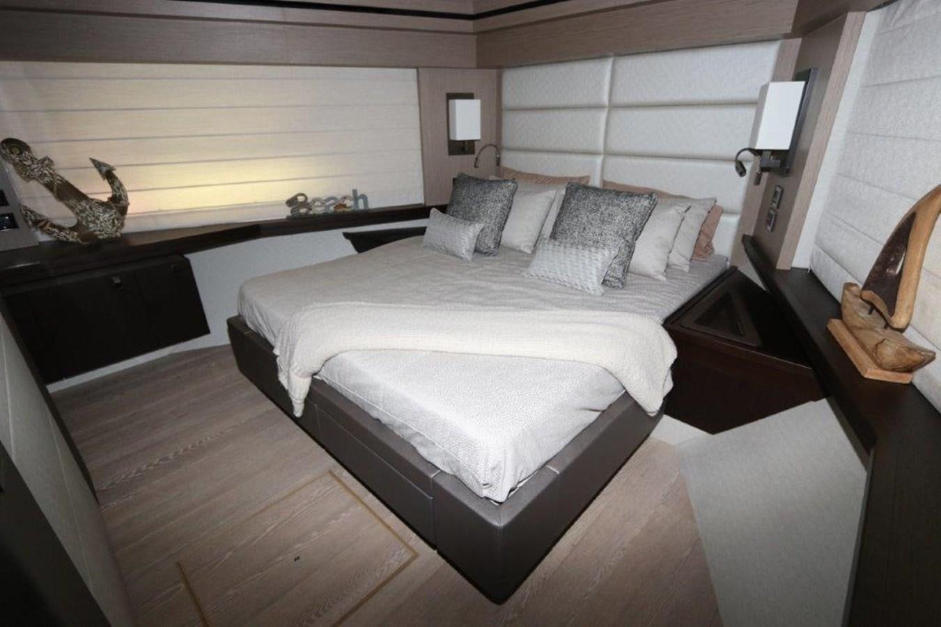 a bed with a white sheet aboard AQUA VISTA Yacht for Sale
