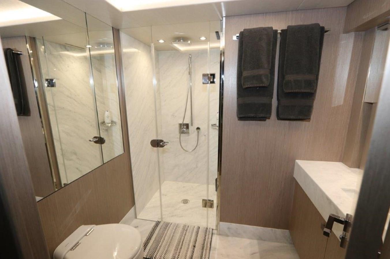 a bathroom with a shower and a sink aboard AQUA VISTA Yacht for Sale