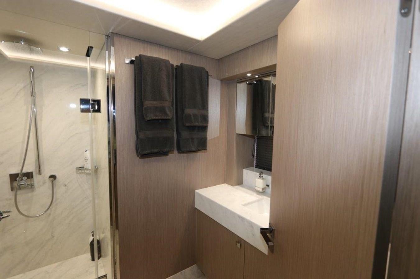 a bathroom with a shower unit and sink aboard AQUA VISTA Yacht for Sale