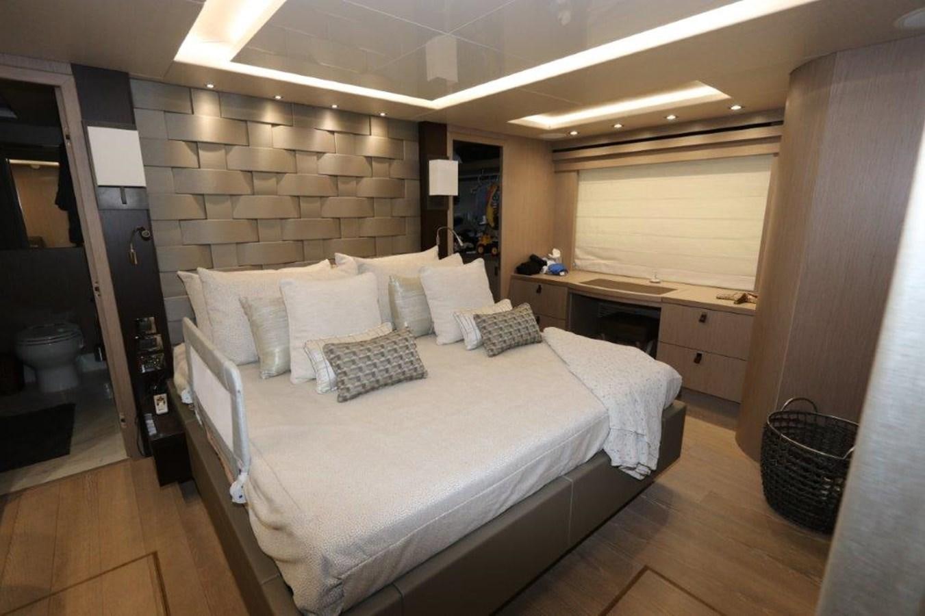 a room with a bed and a desk aboard AQUA VISTA Yacht for Sale