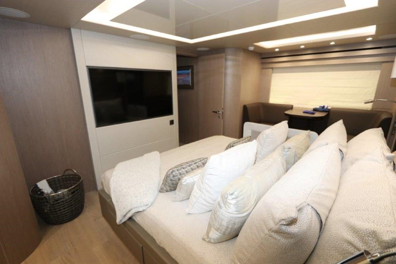 a living room with a couch and a television aboard AQUA VISTA Yacht for Sale