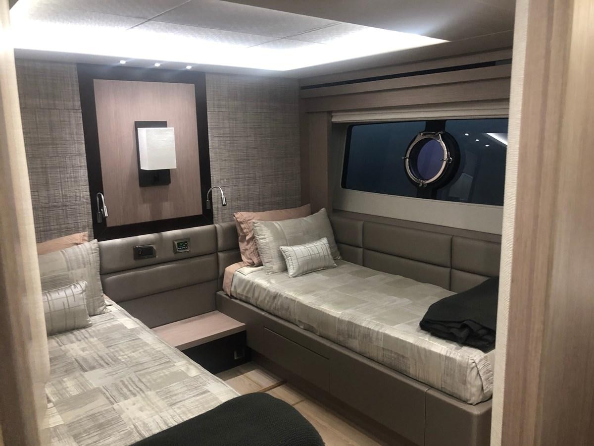 a room with a bed and a mirror aboard AQUA VISTA Yacht for Sale