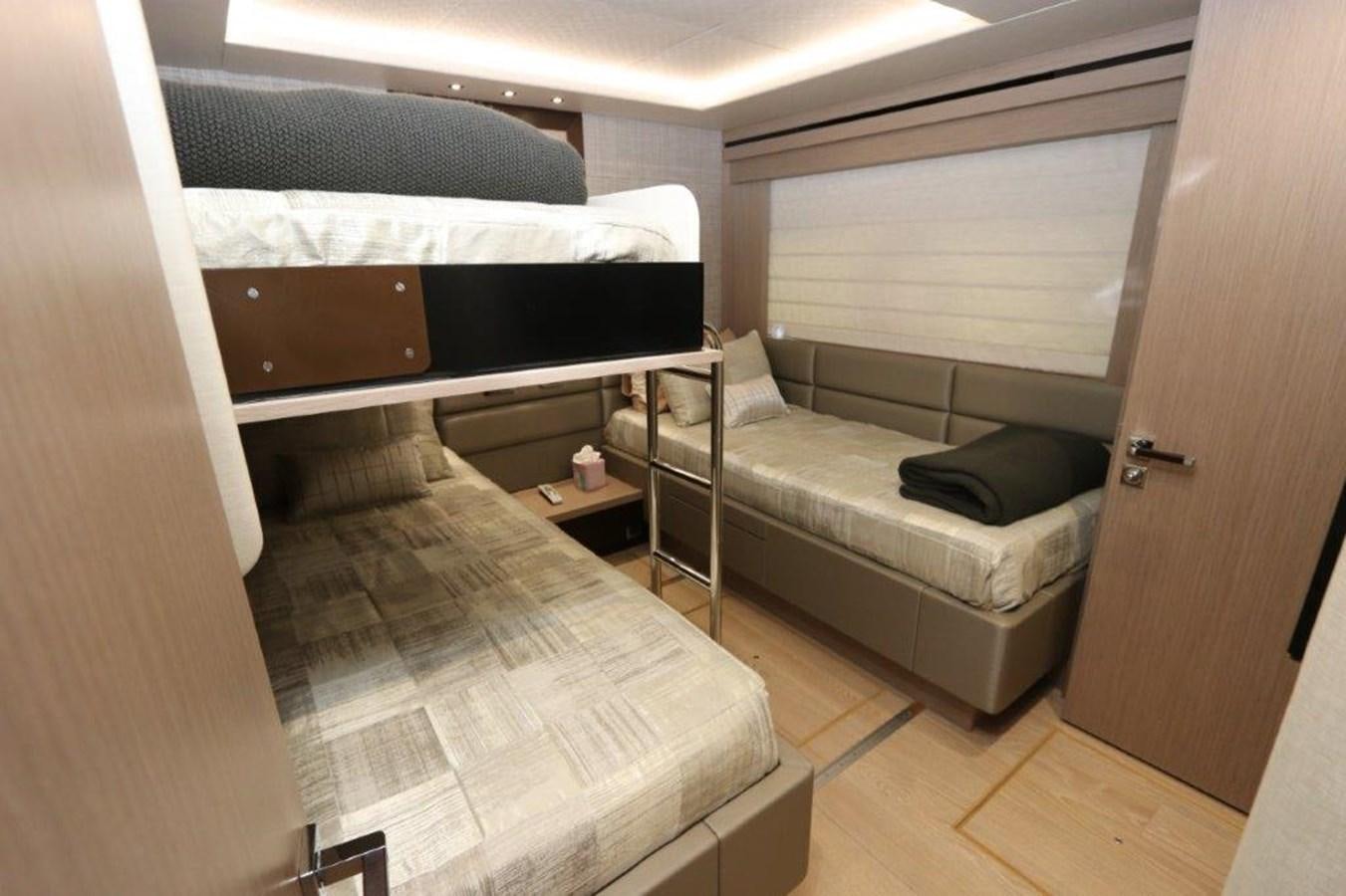 a room with a bed and a couch aboard AQUA VISTA Yacht for Sale