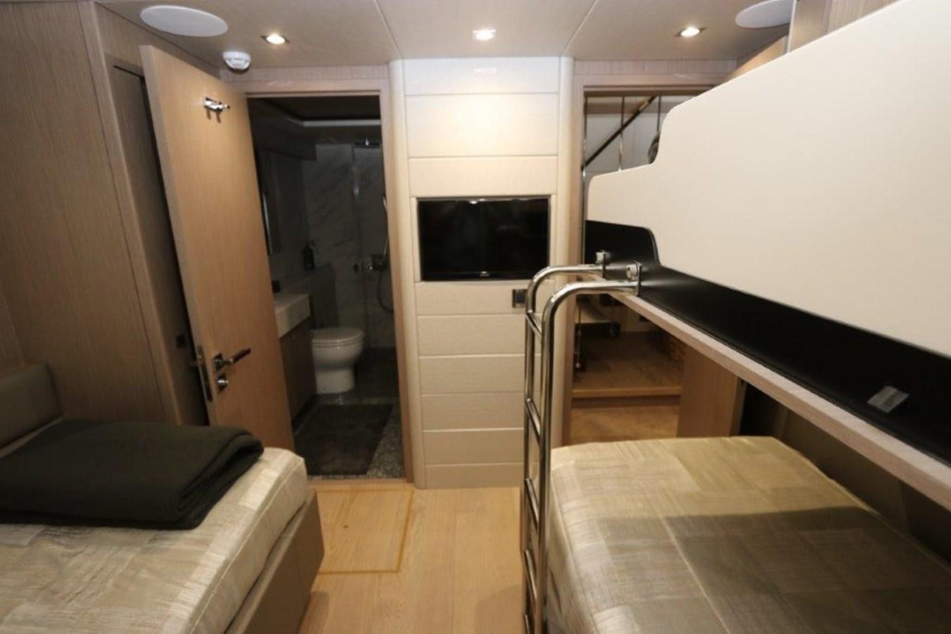 a room with a bed and a television aboard AQUA VISTA Yacht for Sale