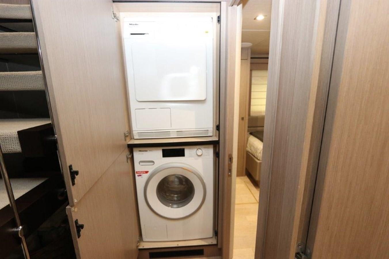 a washer and dryer in a room aboard AQUA VISTA Yacht for Sale