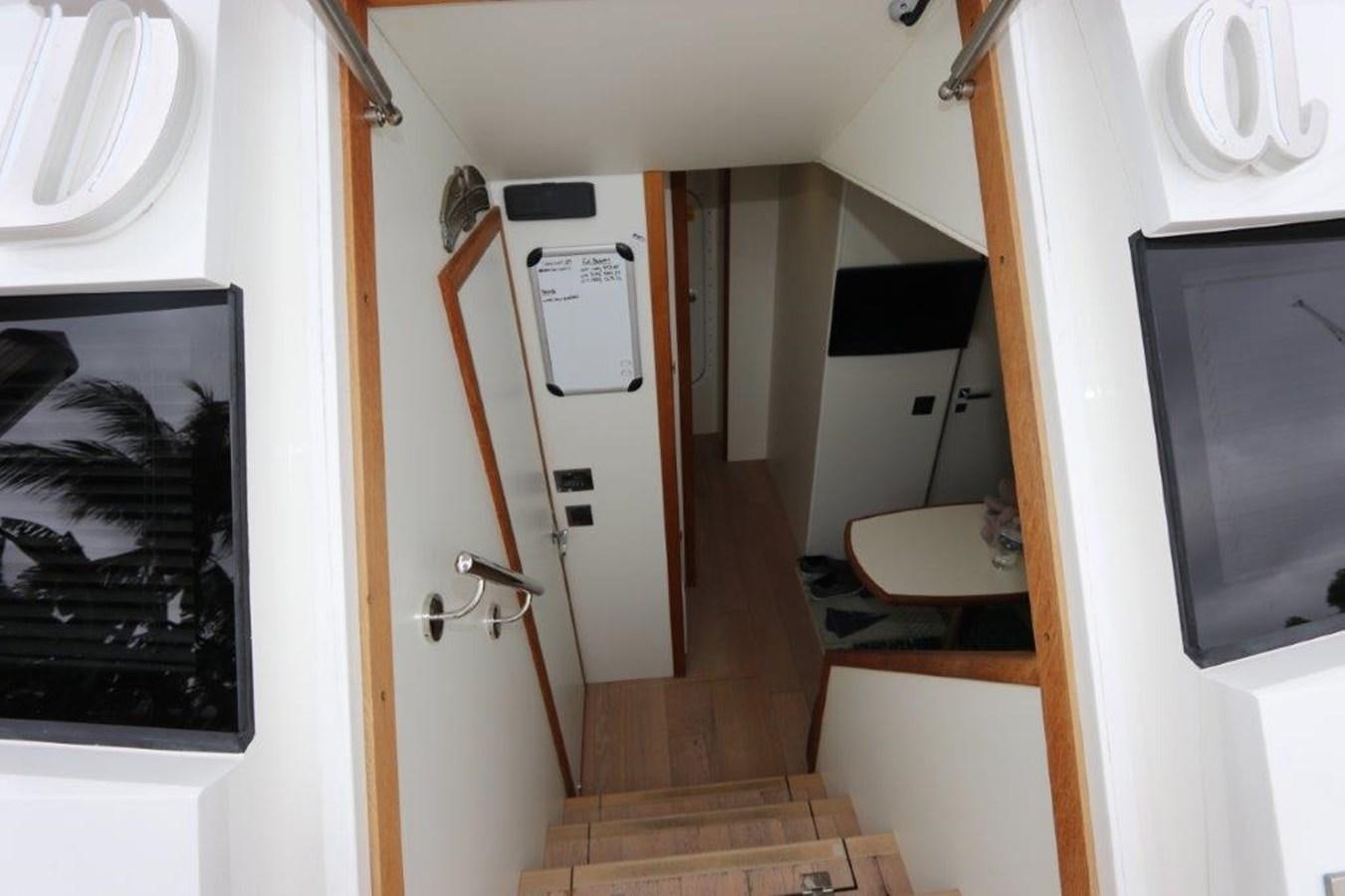 a bathroom with a sink and a mirror aboard AQUA VISTA Yacht for Sale